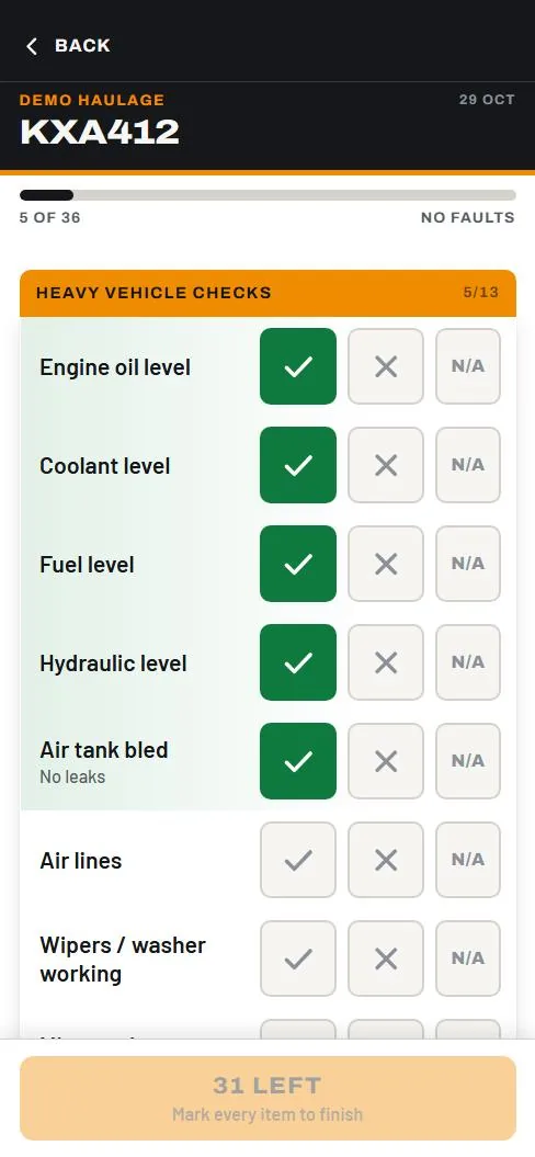 A driver part-way through a truck's daily check on their phone, ticking items off